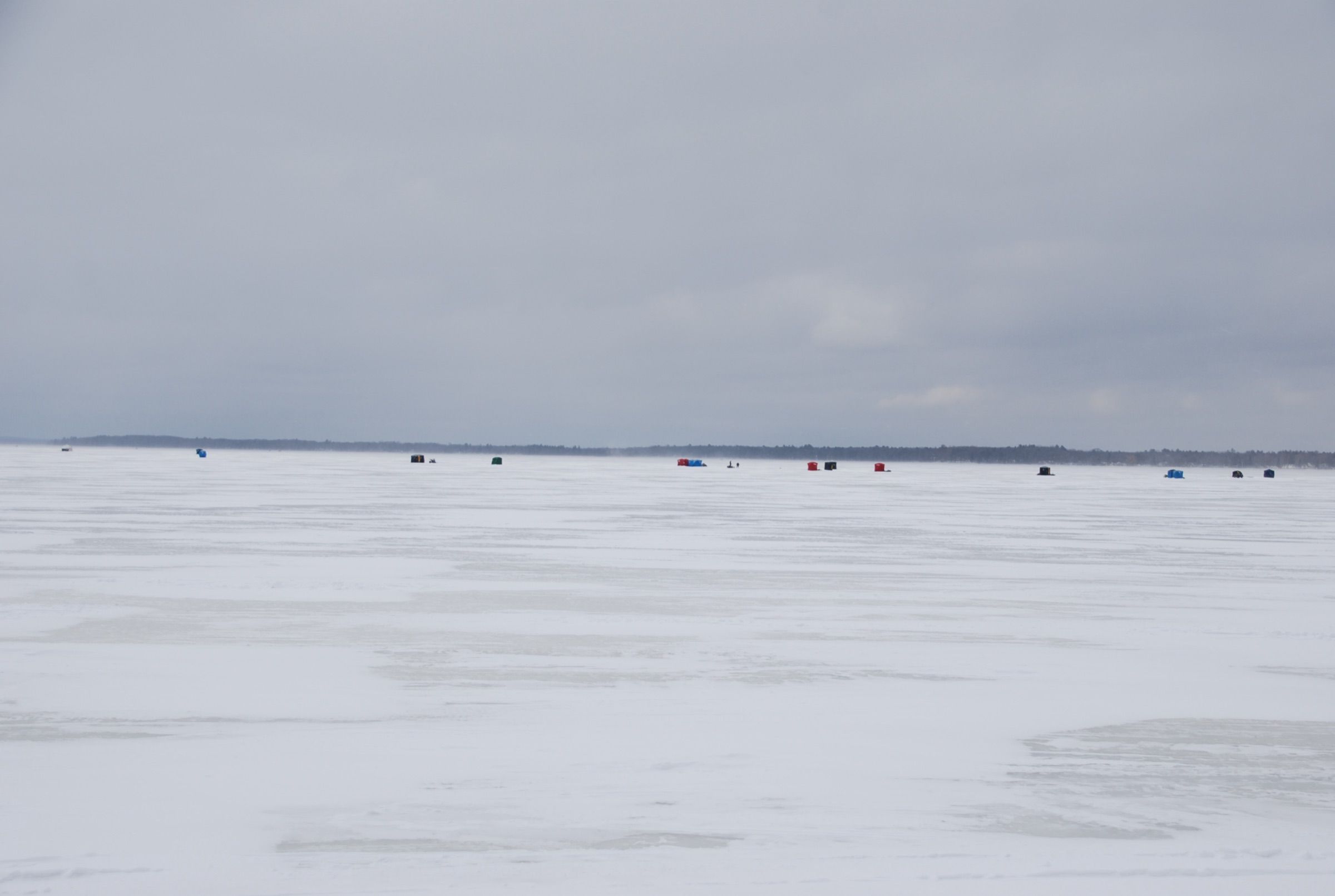 Ice fishing shanties spread across frozen Houghton Lake during Tip-Up Town weekend