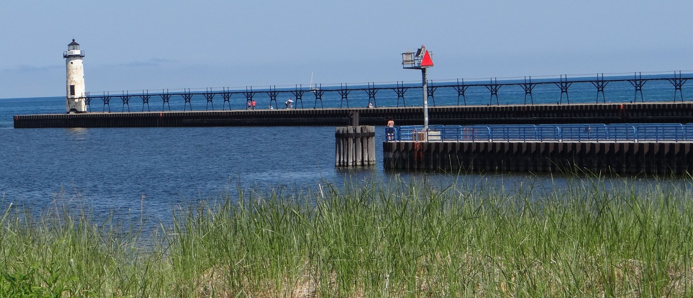 Manistee North Pierhead Lighthouse and breakwater at the mouth of the Manistee River on Lake Michigan