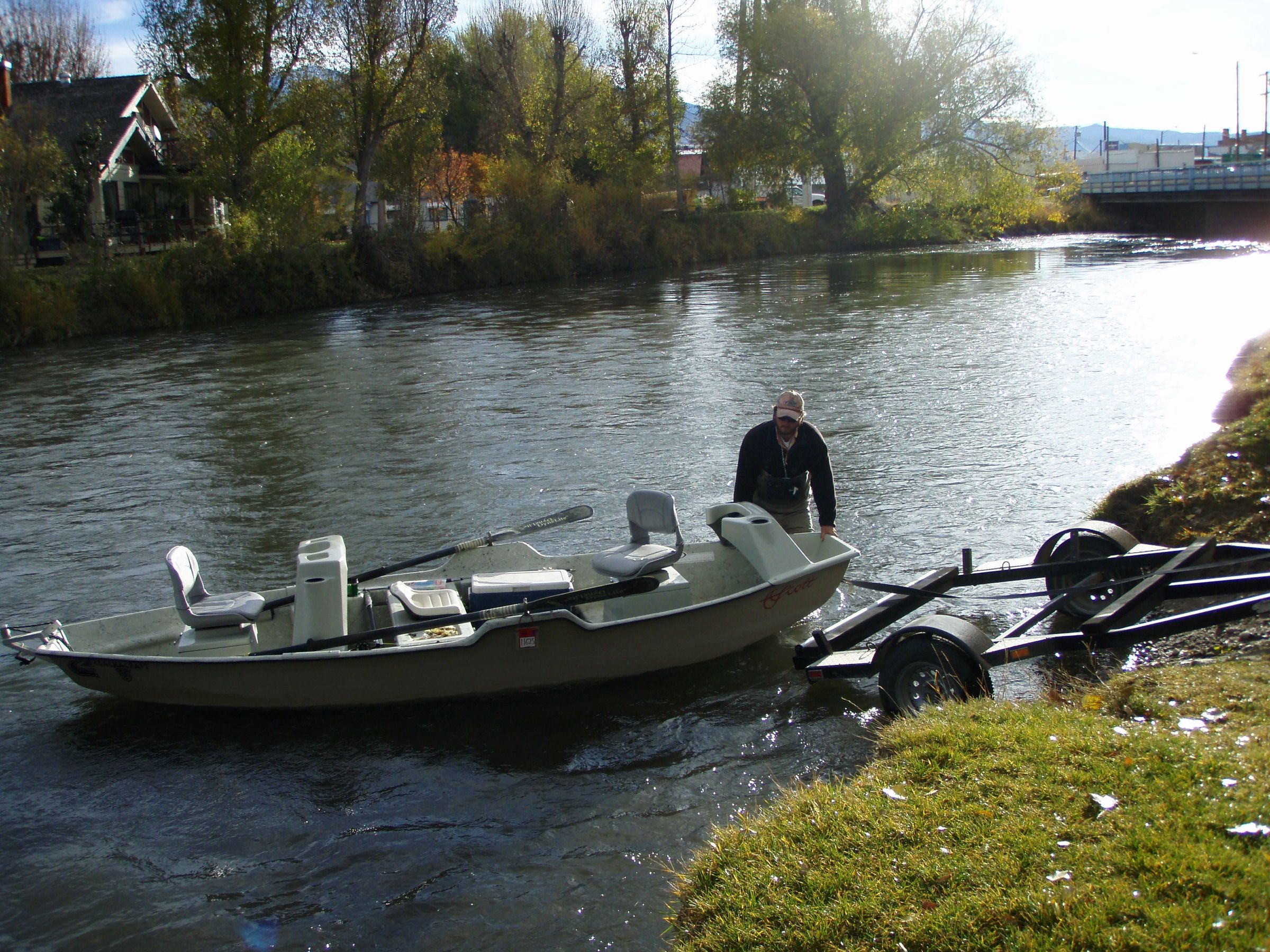 Angler launching a drift boat on the Beaverhead River at Twin Bridges
